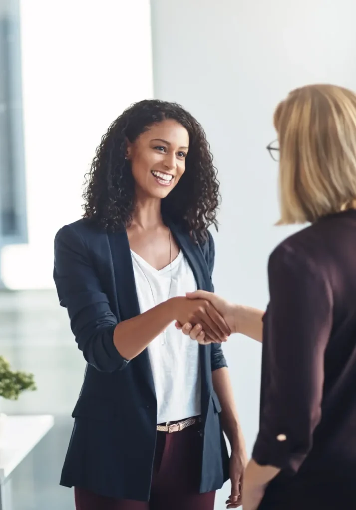 Two people shaking hands after career interview