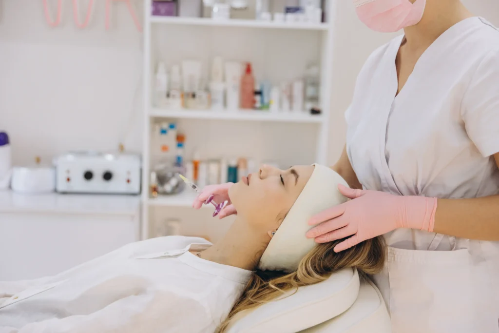 Aesthetician looking at clients face