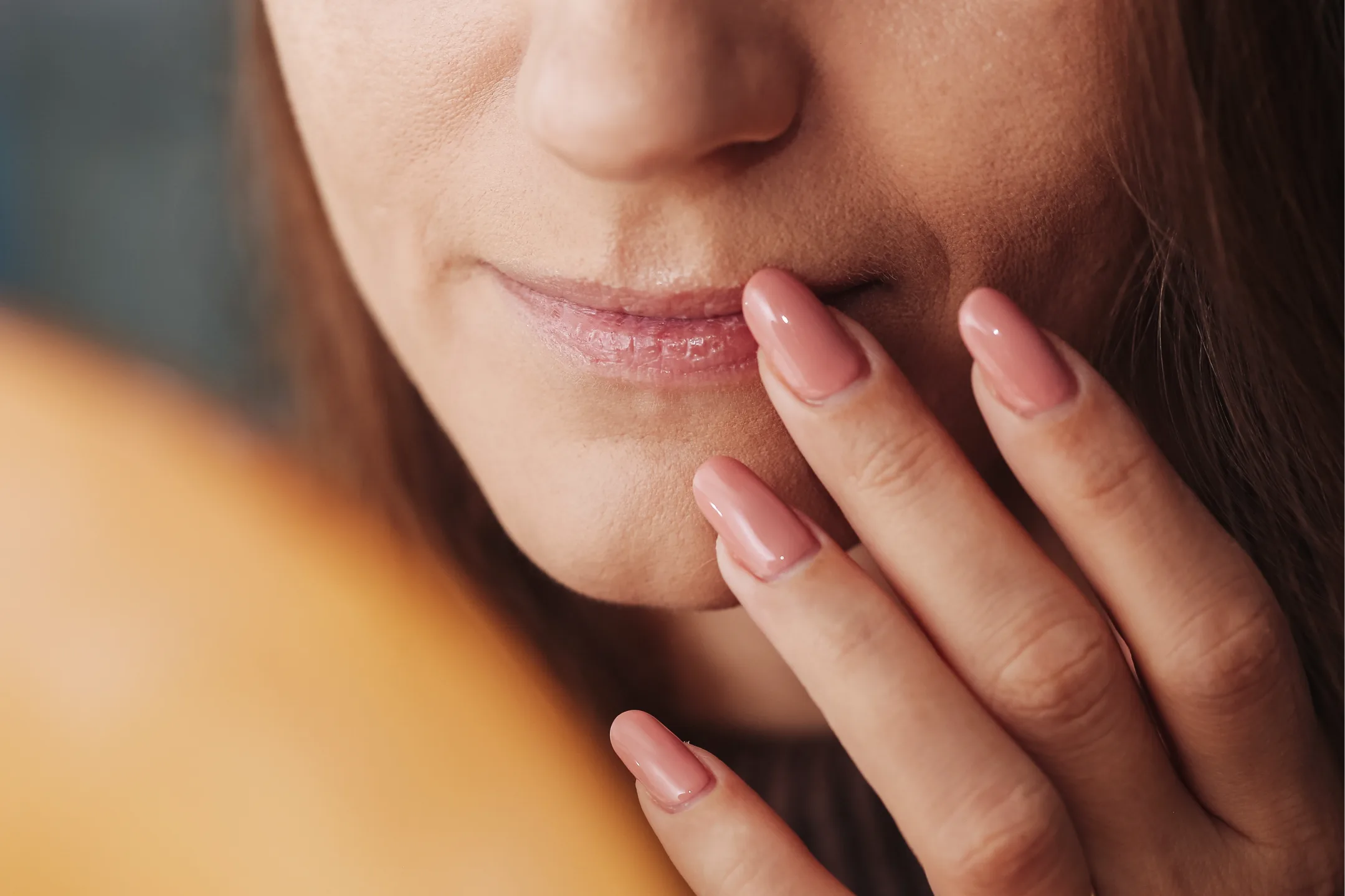 Person touching damaged skin from winter effects