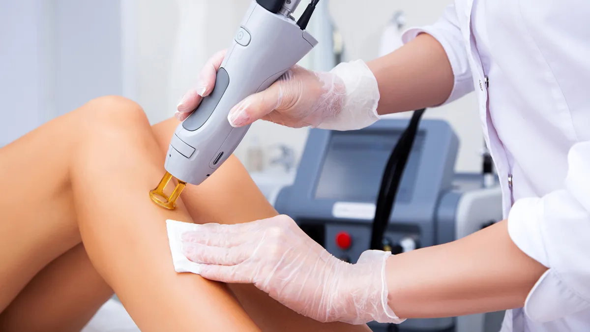 Client getting laser hair removal on legs