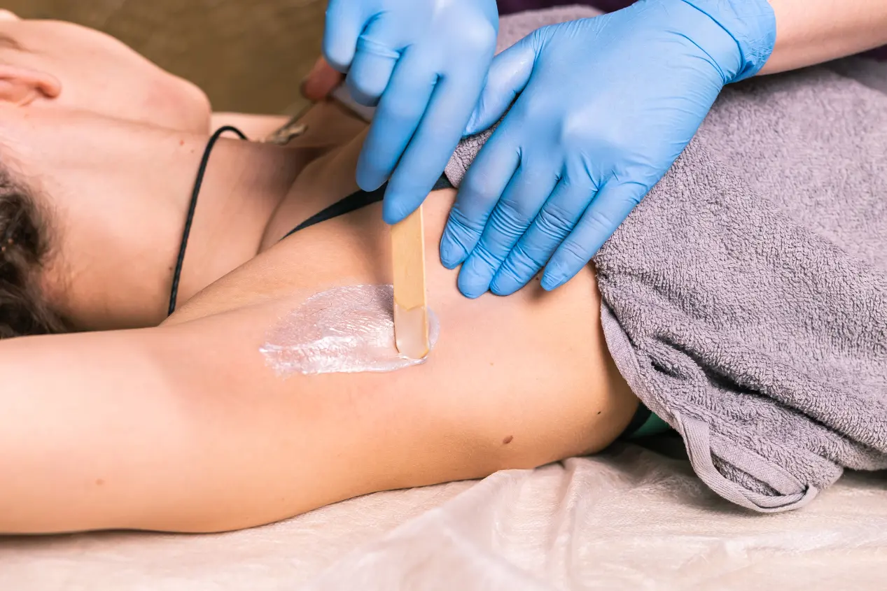 Patient waxing underarms