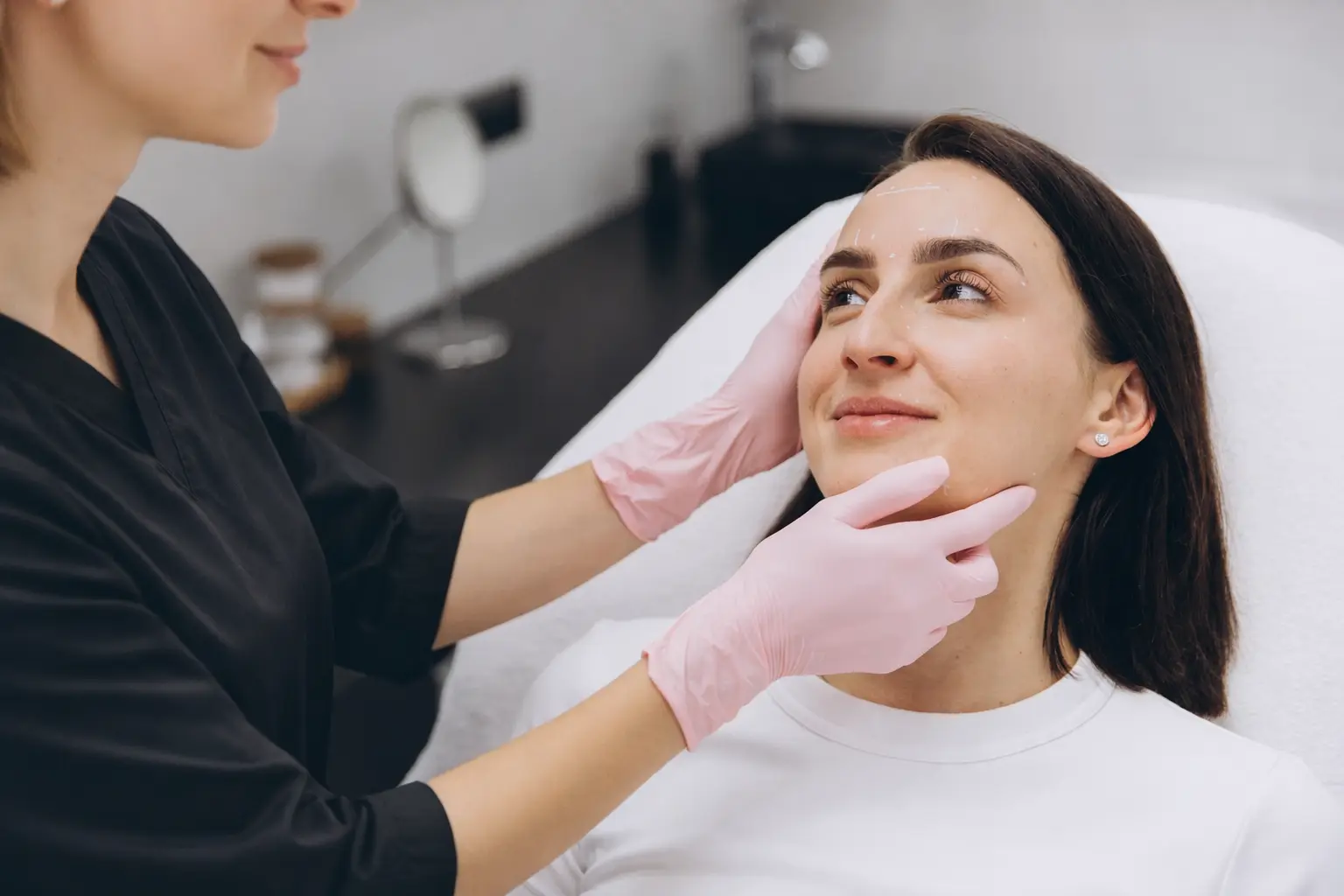 Client getting skin consultation for their face