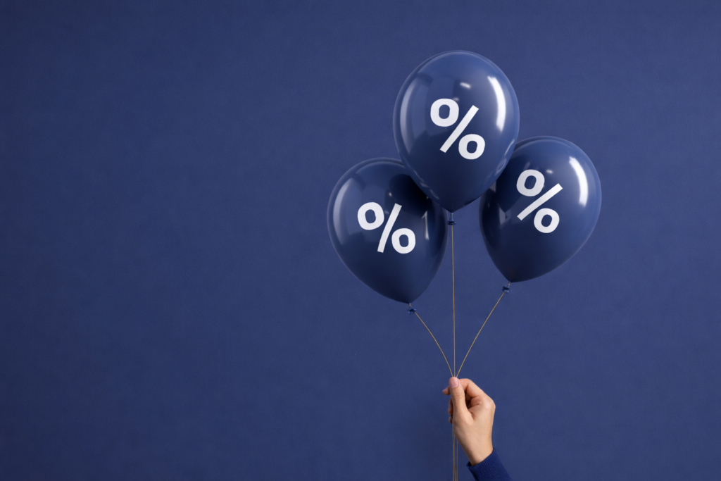 Person holding ballons with discounts for knoxville