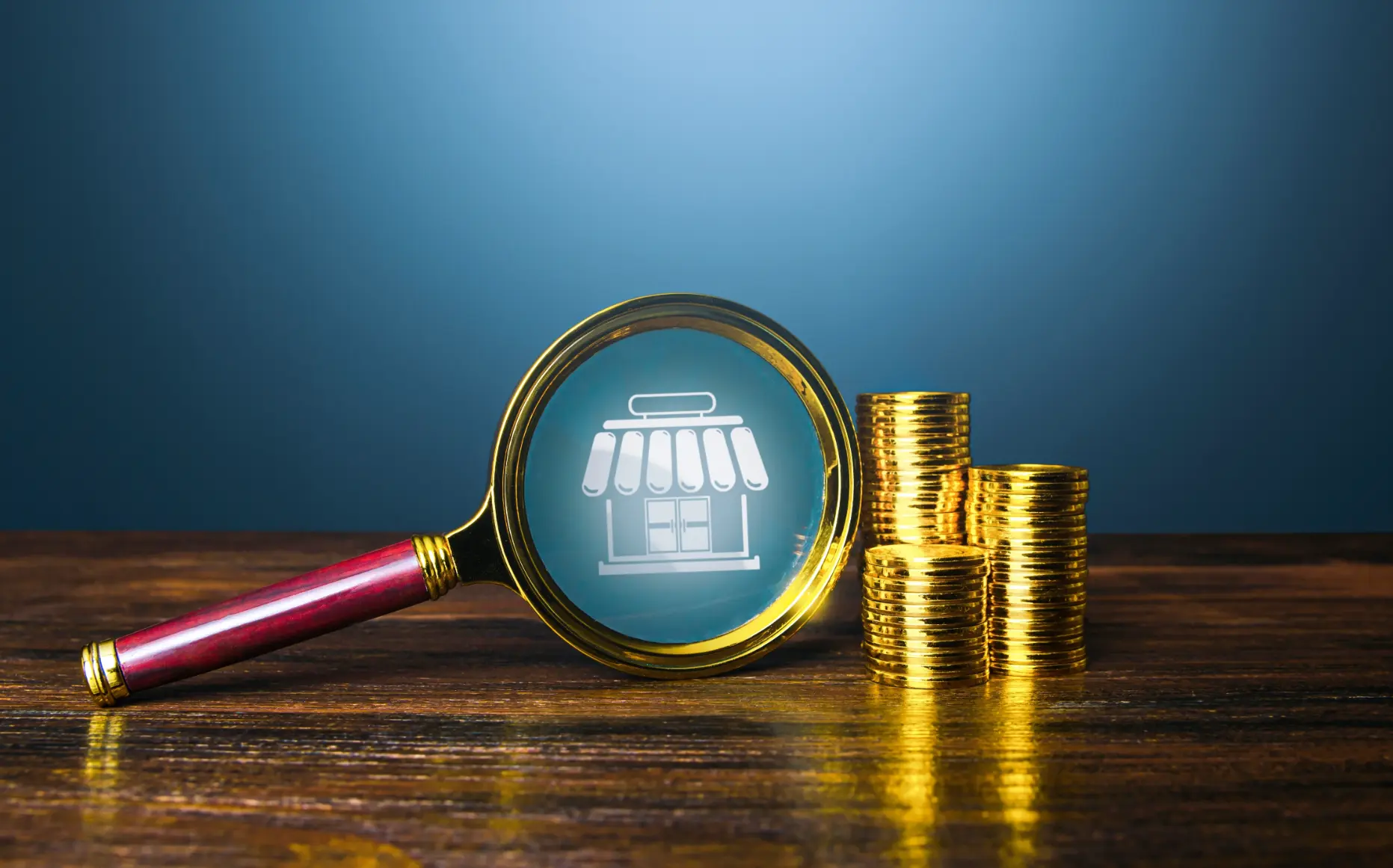 Magnifying glass next to coins