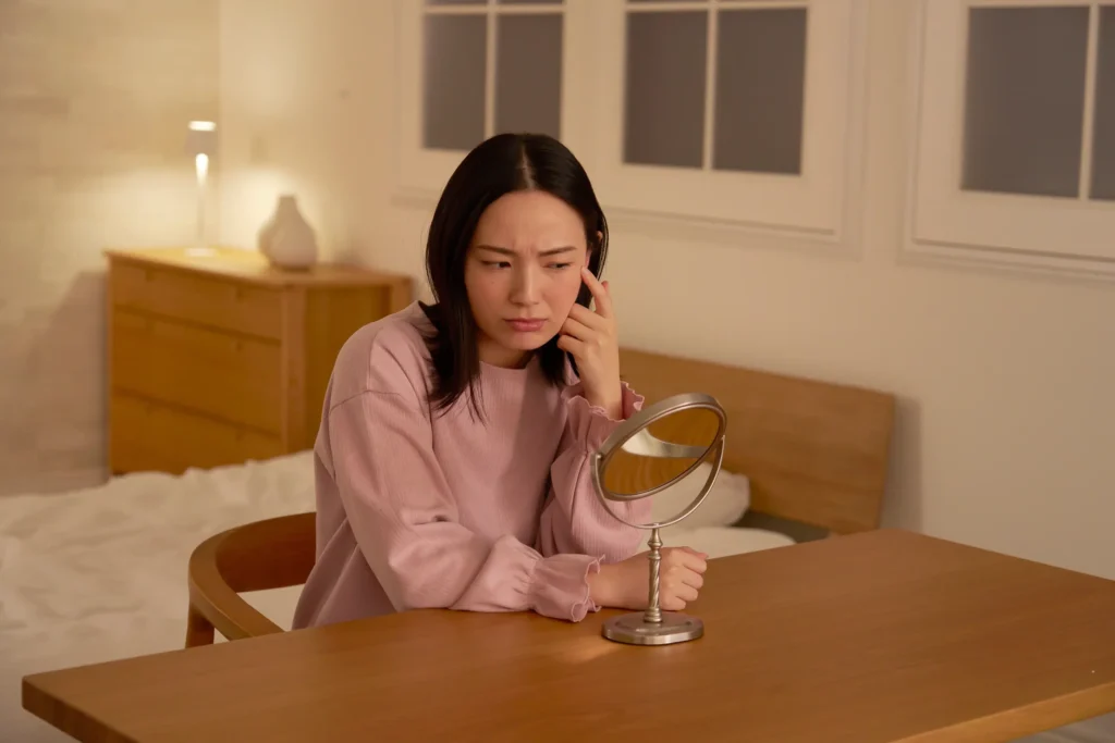 Woman noticing loose skin