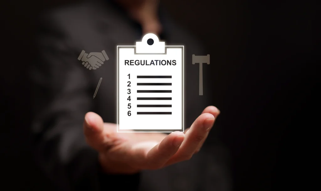 hand holding out Regulations graphic