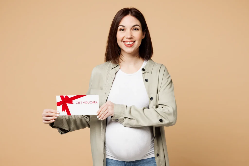 MMom holding a gift card