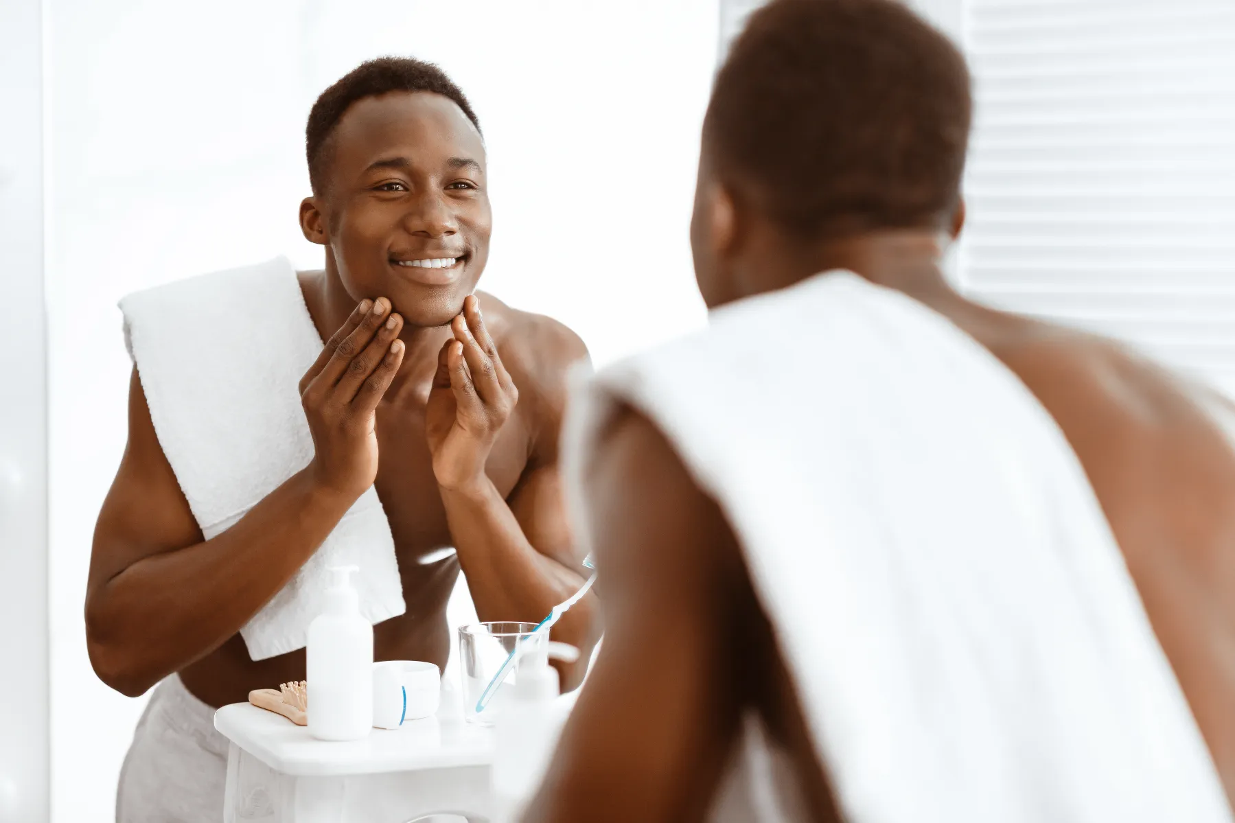Man looking at himself in the mirror